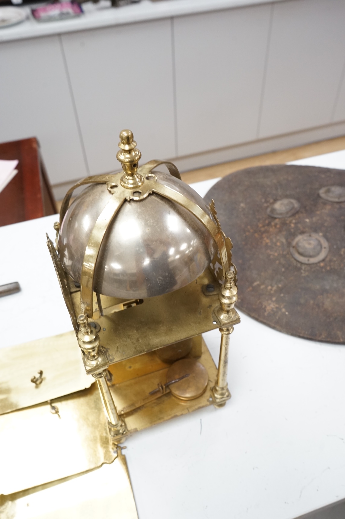 A twin fusee brass lantern clock, 38cm high.